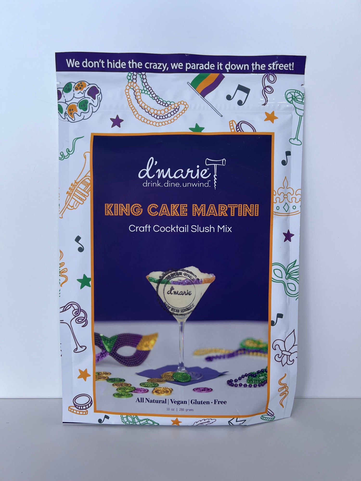 Dmarie King Cake Martini craft cocktail slush mix pouch with Mardi Gras themed illustrations