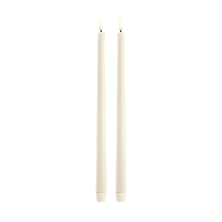 Two off white LED taper candles standing upright