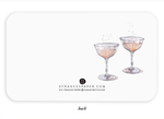 Watercolor illustration of two champagne coupes on the back of a greeting card
