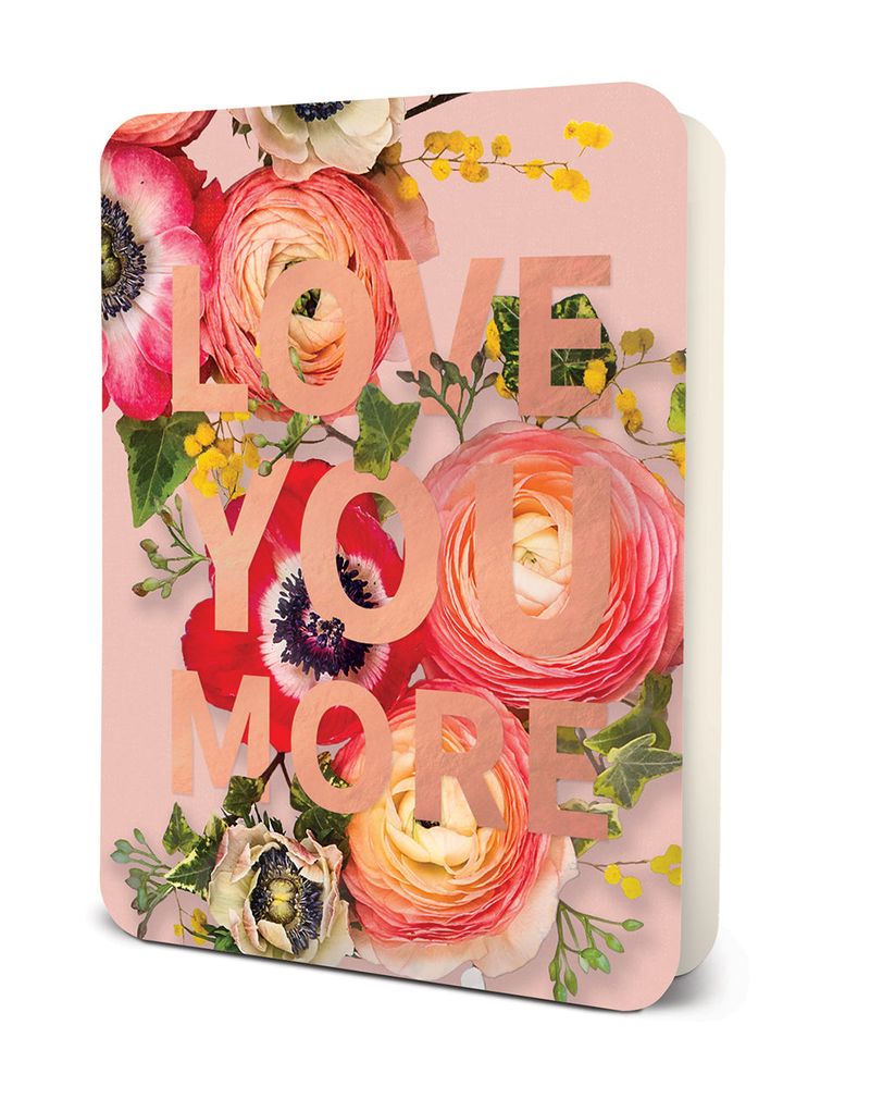 Notebook with pink floral background and rose gold text reading Love You More