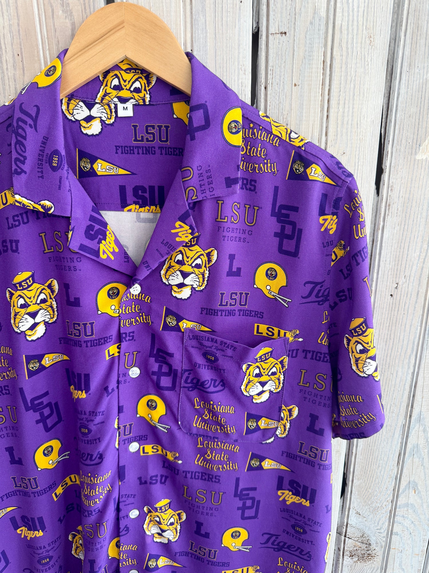 Purple button down shirt with LSU Fighting Tigers logos and text pattern