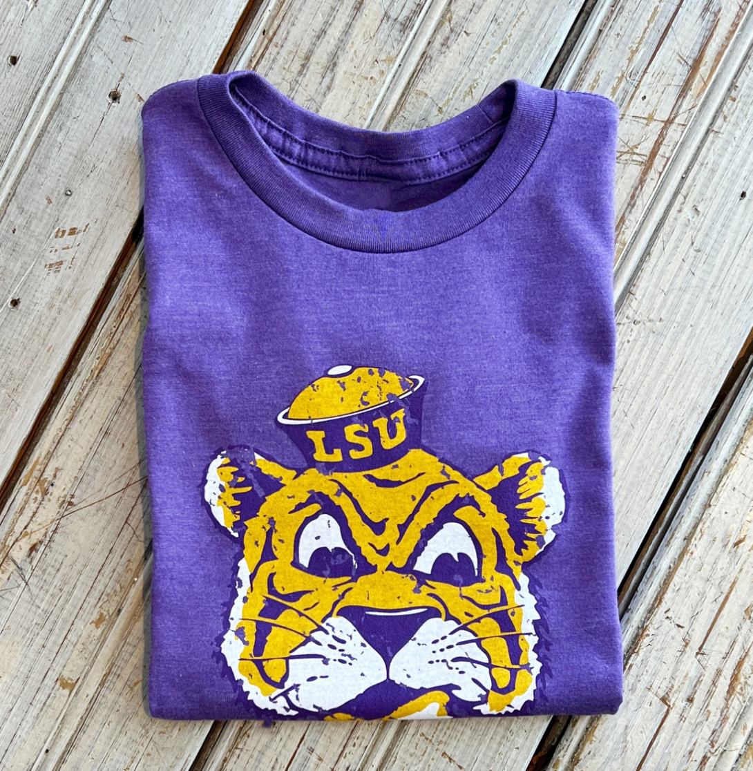Purple LSU t-shirt with a distressed tiger mascot graphic wearing a pot