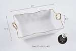 Pampa Bay porcelain rectangular serving dish with a hammered white finish wavy gold-rimmed edge and two gold loop handles measuring 17 by 11.5 by 4.5 inches