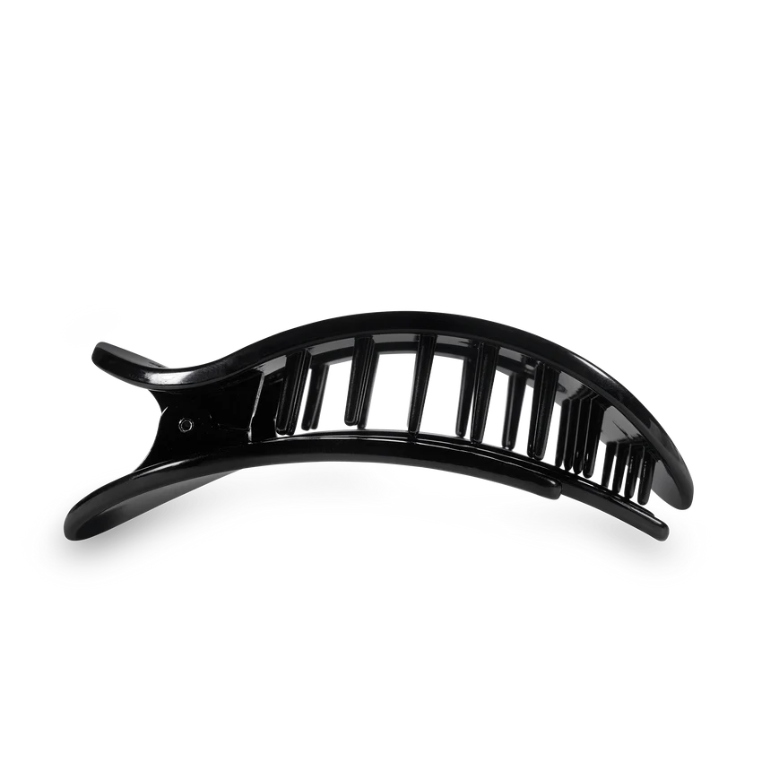 Black glossy plastic hair claw clip with a curved design and segmented teeth on a black background