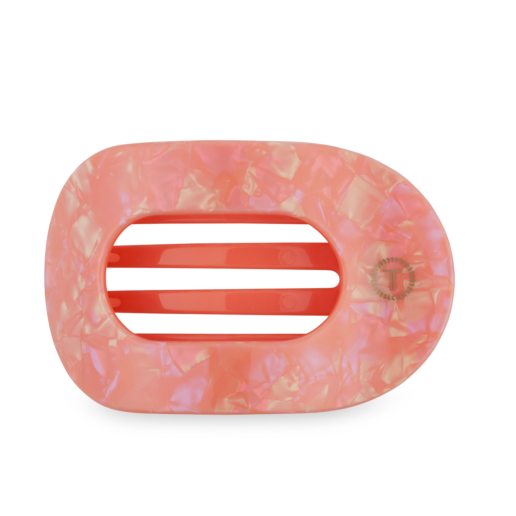 Resin iridescent peachy pink oblong hair claw clip with mottled pattern, coral pink internal teeth, and a gold T brand logo