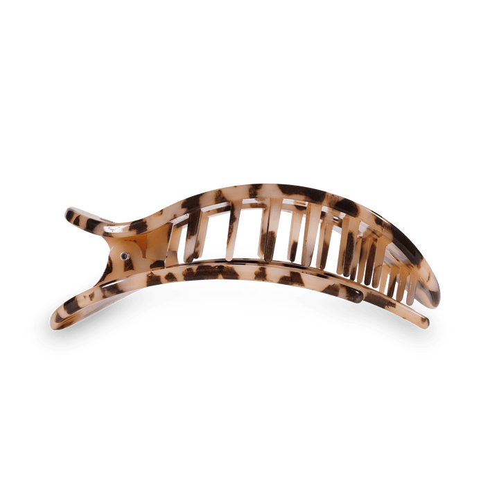 Acetate hair claw clip in a brown and beige leopard print with a curved open-claw design