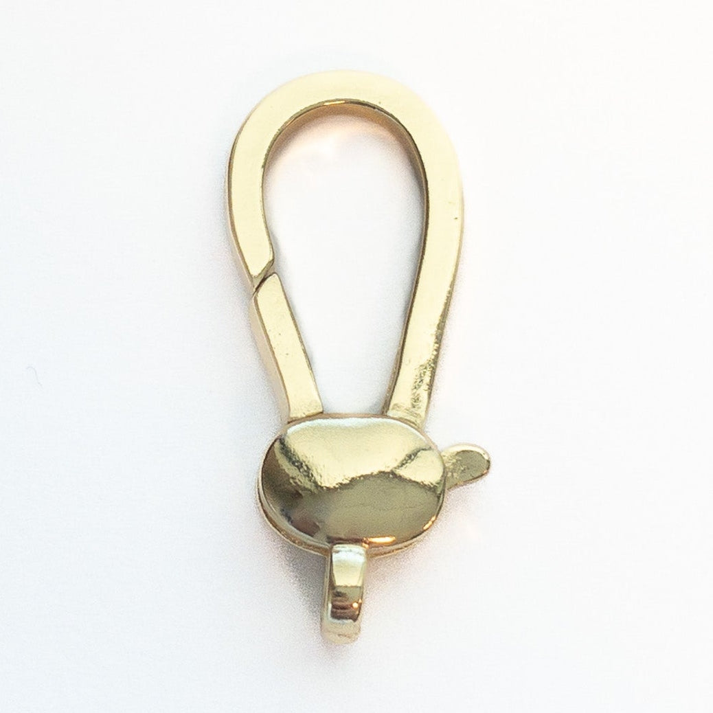 Gold-tone swivel lobster clasp with a reflective metallic finish an elongated U-shaped top and a small thumb tab for opening