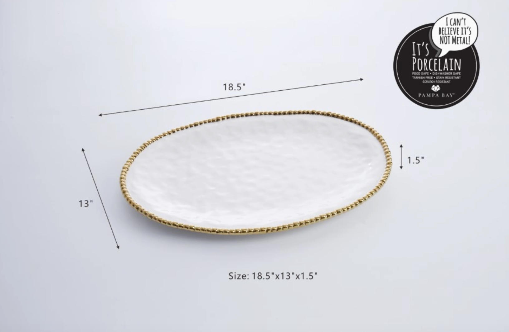 Pampa Bay white porcelain oval serving platter with a hammered surface and gold beaded rim featuring dimensions of 18.5x13x1.5 inches