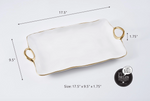 Pampa Bay white porcelain rectangular serving tray with wavy gold trim and two round gold handles measuring 17.5 x 9.5 x 1.75 inches showcasing its metal-like appearance