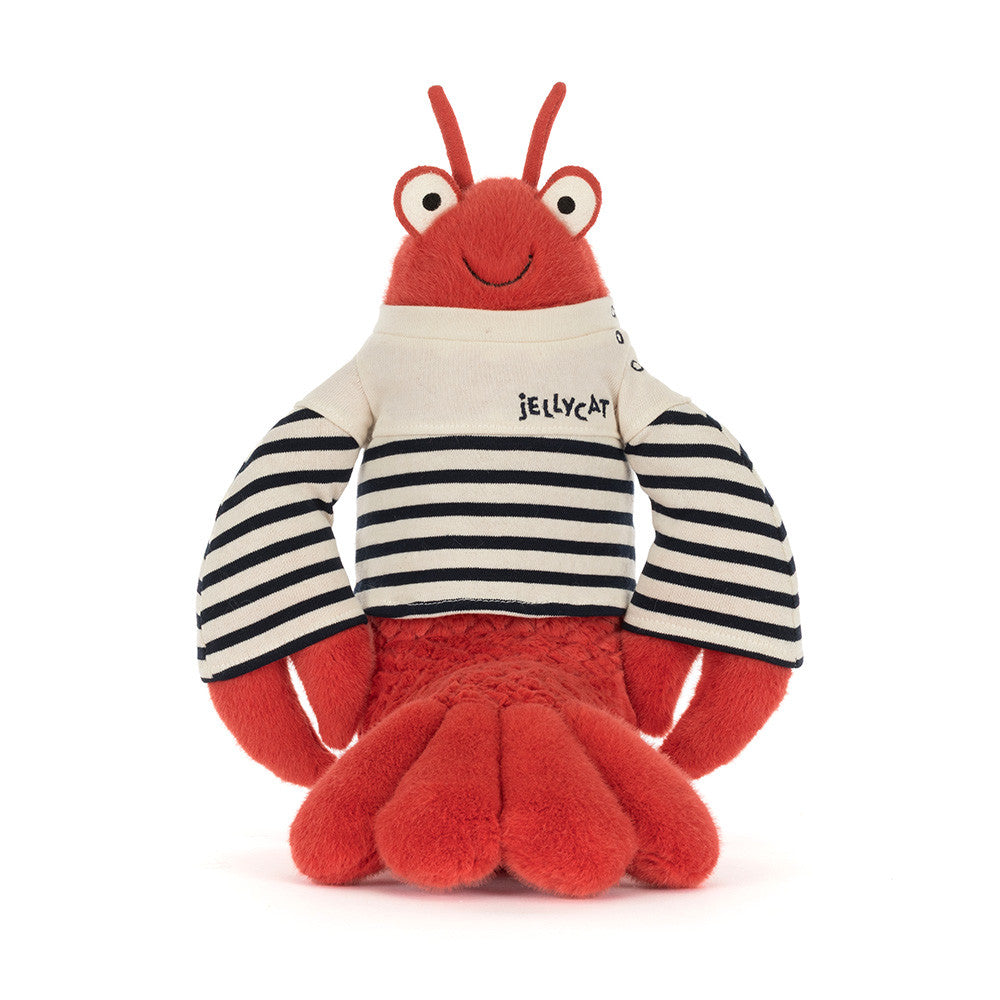 Plush toy by Jellycat, a vibrant red lobster plush toy on a white background wearing a classic cream and navy striped Breton shirt with "Jellycat" embroidered, featuring prominent eyes and a cheerful stitched smile