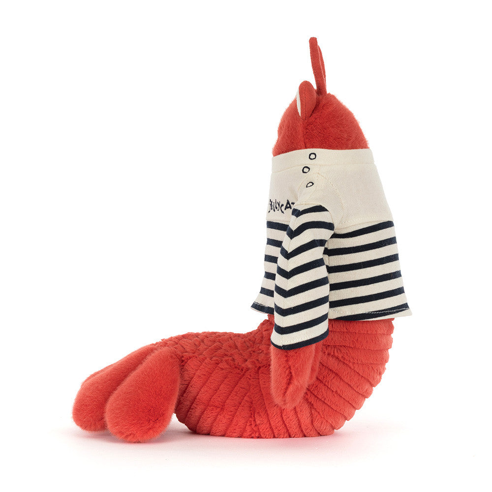 Jellycat plush toy red lobster wearing a cream and navy striped sailor shirt embroidered with Jellycat, featuring fluffy claws and a ridged tail