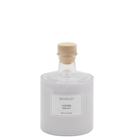 Archipelago lavender bubble bath in a clear glass bottle with a wooden stopper