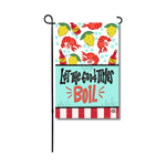 Printed garden flag by DK Designs featuring a lively seafood boil theme with red lobsters, yellow lemons, red hot sauce bottles, and the phrase "Let The Good Times BOIL" on a light blue background above bold red and white stripes