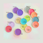 Graphic art featuring fifteen round color palette swatches with diagonal stripes, individually named like the pink and green Watermelon, bright yellow and pink Lemonade, and deep blue and green Ocean Waves designs