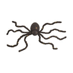Halloween decoration black fuzzy spider with illuminated yellow lights on its eight fuzzy bendable legs and two-part body