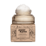 Product Photography by Poppy & Pout of an Island Coconut Exfoliating Lip Scrub in a clear glass jar with white scrub overflowing, resting on a kraft paper box featuring black outline poppy flower illustrations