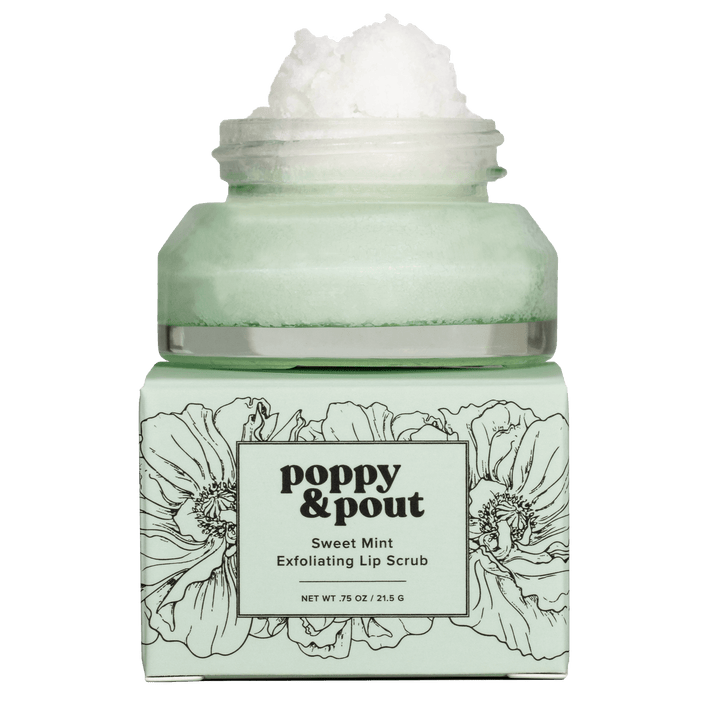 Poppy & Pout Sweet Mint Exfoliating Lip Scrub, a light green jar overflowing with white scrub, sits atop its matching box adorned with black poppy floral illustrations
