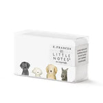 E. FRANCES stationery product photography showing a clear rectangular box of 85 Little Notes featuring watercolor illustrations of four distinct dogs including a golden retriever and a gray terrier with suggested uses like Lunch Box Love and Gift Toppers