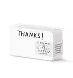 Product photography by E.FRANCES featuring a clear plastic box of white Little Notes cards displaying the word THANKS in bold black text with a small teal dot, a label reading E.FRANCES 85 LITTLE NOTES use unsparingly, and a side panel listing uses such as Lunch Box Love Surprise Hellos Pocket Notes Gift Toppers Placecards