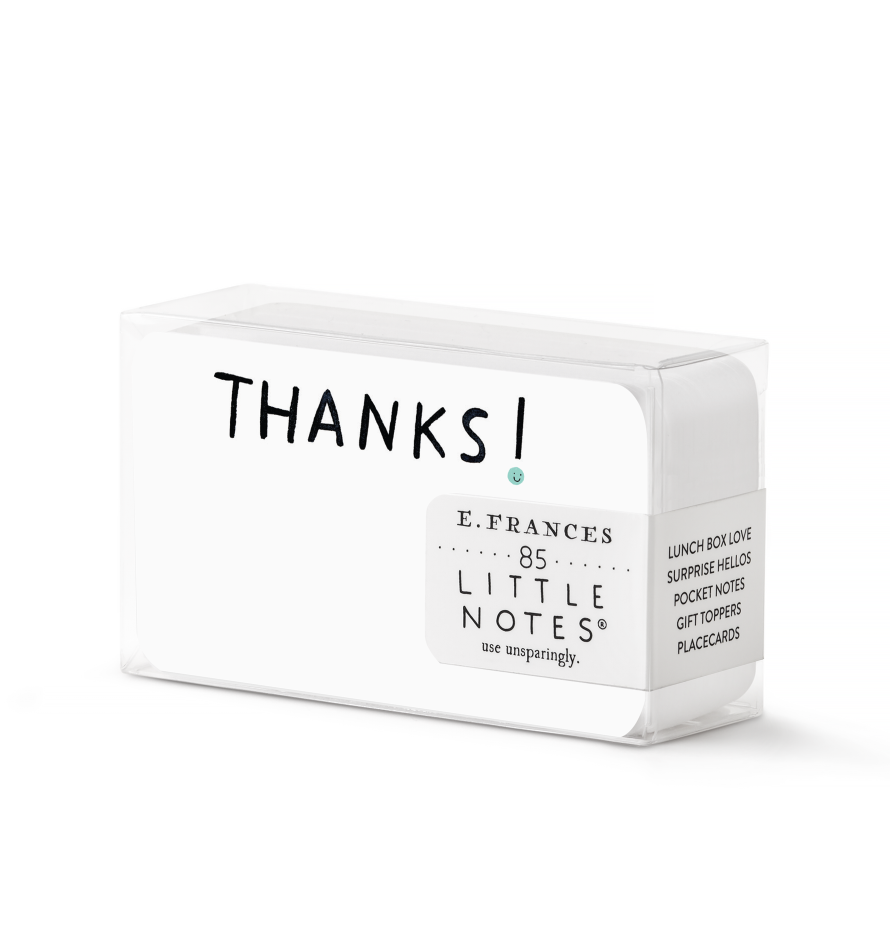 Product photography by E.FRANCES featuring a clear plastic box of white Little Notes cards displaying the word THANKS in bold black text with a small teal dot, a label reading E.FRANCES 85 LITTLE NOTES use unsparingly, and a side panel listing uses such as Lunch Box Love Surprise Hellos Pocket Notes Gift Toppers Placecards