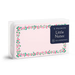 E. Frances Little Notes stationery set featuring light pink cards with a cheerful pink floral and green leaf border, contained in a clear acrylic box with a dark blue label stating 55 USE UNSPARINGLY