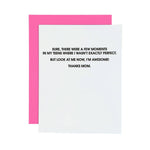 Greeting card featuring a white card with bold black text reading "SURE, THERE WERE A FEW MOMENTS IN MY TEENS WHERE I WASN'T EXACTLY PERFECT. BUT LOOK AT ME NOW, I'M AWESOME! THANKS MOM" partially obscuring a vibrant hot pink envelope
