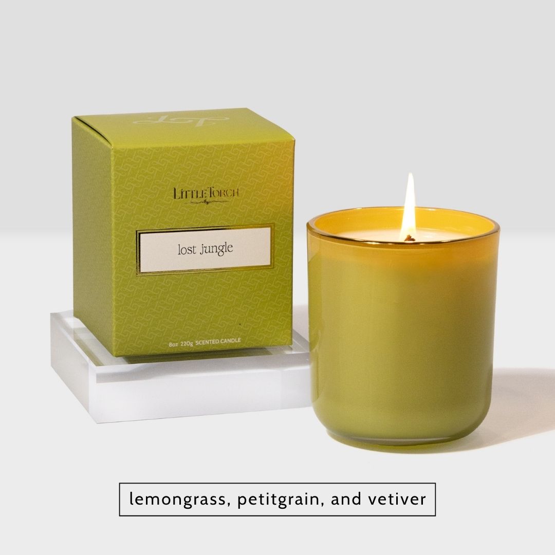 Little Torch Lost Jungle scented candle in a green glass jar with matching box