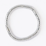 Flexible segmented silver-toned ring composed of small shiny rectangular links on a white background