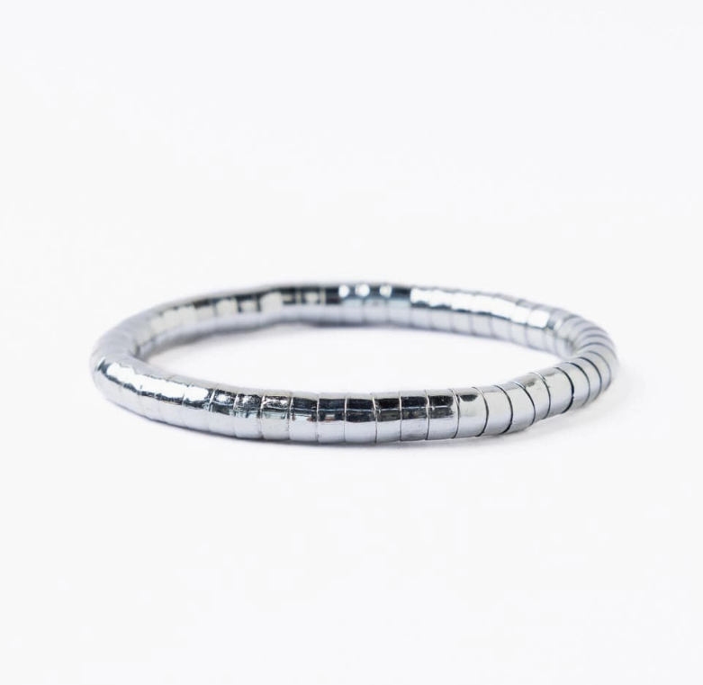 A metallic grey segmented flexible bracelet with a glossy finish on a clean white background