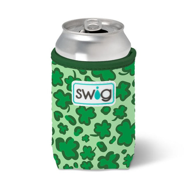 Photograph of a Swig branded light green can cooler with dark green shamrocks, holding a silver beverage can and displaying the Swig logo with a blue droplet