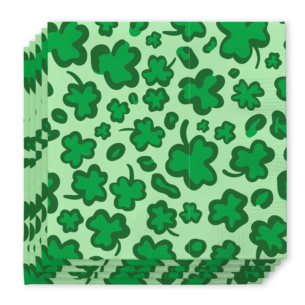 Stack of light green paper napkins with dark green shamrock pattern