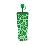 Product photograph of a green Swig insulated tumbler featuring a glittery shamrock pattern, a dark green lid, and a prominent shamrock-shaped straw topper