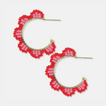Beaded jewelry featuring two gold hoop earrings adorned with vibrant red and pink seed beads forming a scalloped pattern