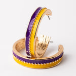 Gold hoop earrings with purple and yellow enamel stripes and beaded detail