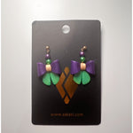 Satazi polymer clay earrings shaped as purple and green bows with gold green and purple bead accents displayed on a black product card