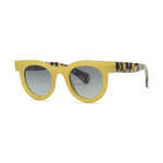 Yellow sunglasses with patterned arms on a white background