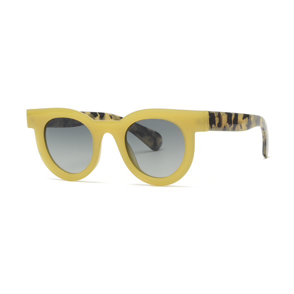 Yellow sunglasses with patterned arms on a white background