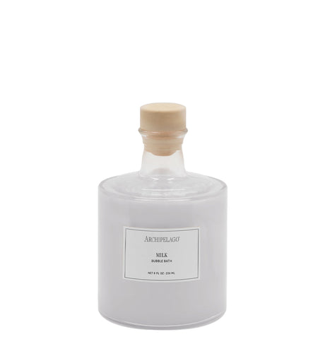 A clear glass bottle with a wooden cap and a label that reads 'Arts & Science Bubble Bath 8oz'.
