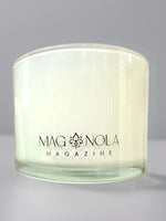 Clear glass candle jar with Magnolia Magazine logo printed on the front
