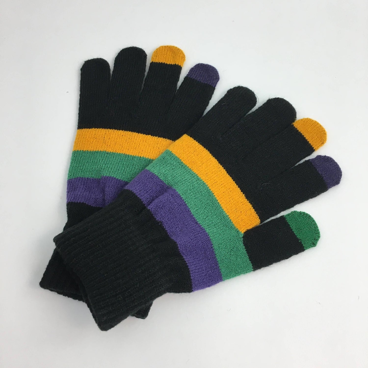 Photograph of a pair of black knit gloves with vibrant purple, green, and gold horizontal stripes and colored touchscreen-compatible fingertips reminiscent of Mardi Gras colors