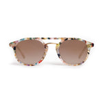 Speckled multicolor acetate sunglasses with round brown gradient lenses and a gold metal bridge on a white background