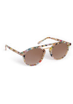 A pair of stylish sunglasses on a white background, featuring a vibrant multicolored speckled frame, brown gradient lenses, and subtle gold-tone hardware