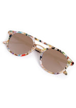 Multicolor acetate sunglasses with round brown tinted lenses and gold metal bridge and stud details on a white background