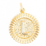 Gold circular initial pendant featuring the letter L on a hammered textured background with a shiny fluted border and a small top bail
