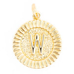 Gold charm featuring a shiny capital W on a textured circular disc with a ribbed border