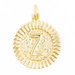 Gold round pendant featuring a capital letter Z on a stippled center background with a fluted sunburst border and small bail loop