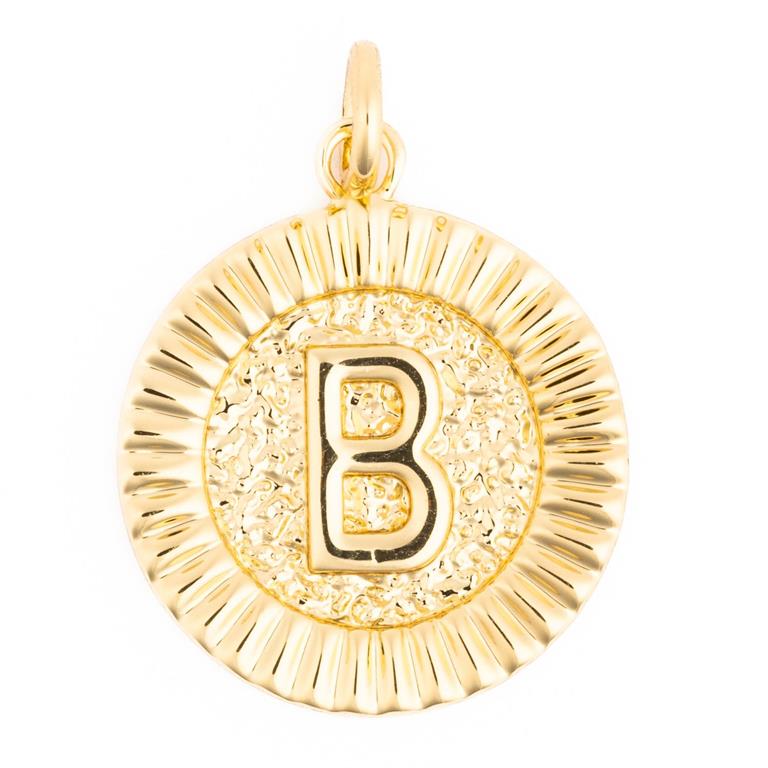 Gold metal charm featuring a round design with a prominent capital letter B on a hammered texture background and a fluted outer rim