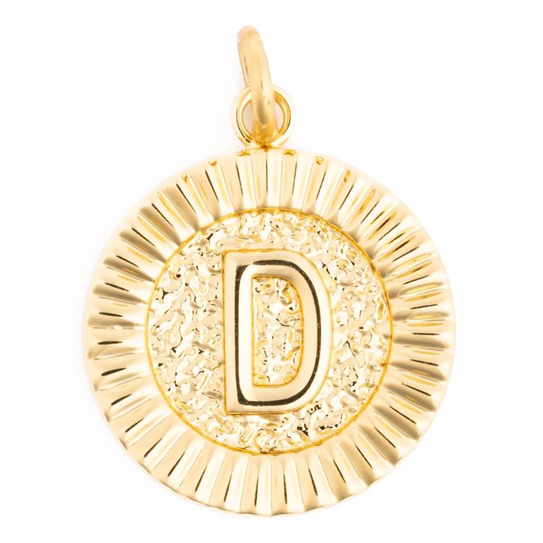 Photograph of a round golden initial D pendant featuring a hammered texture behind the letter and a fluted outer rim with a small bail loop
