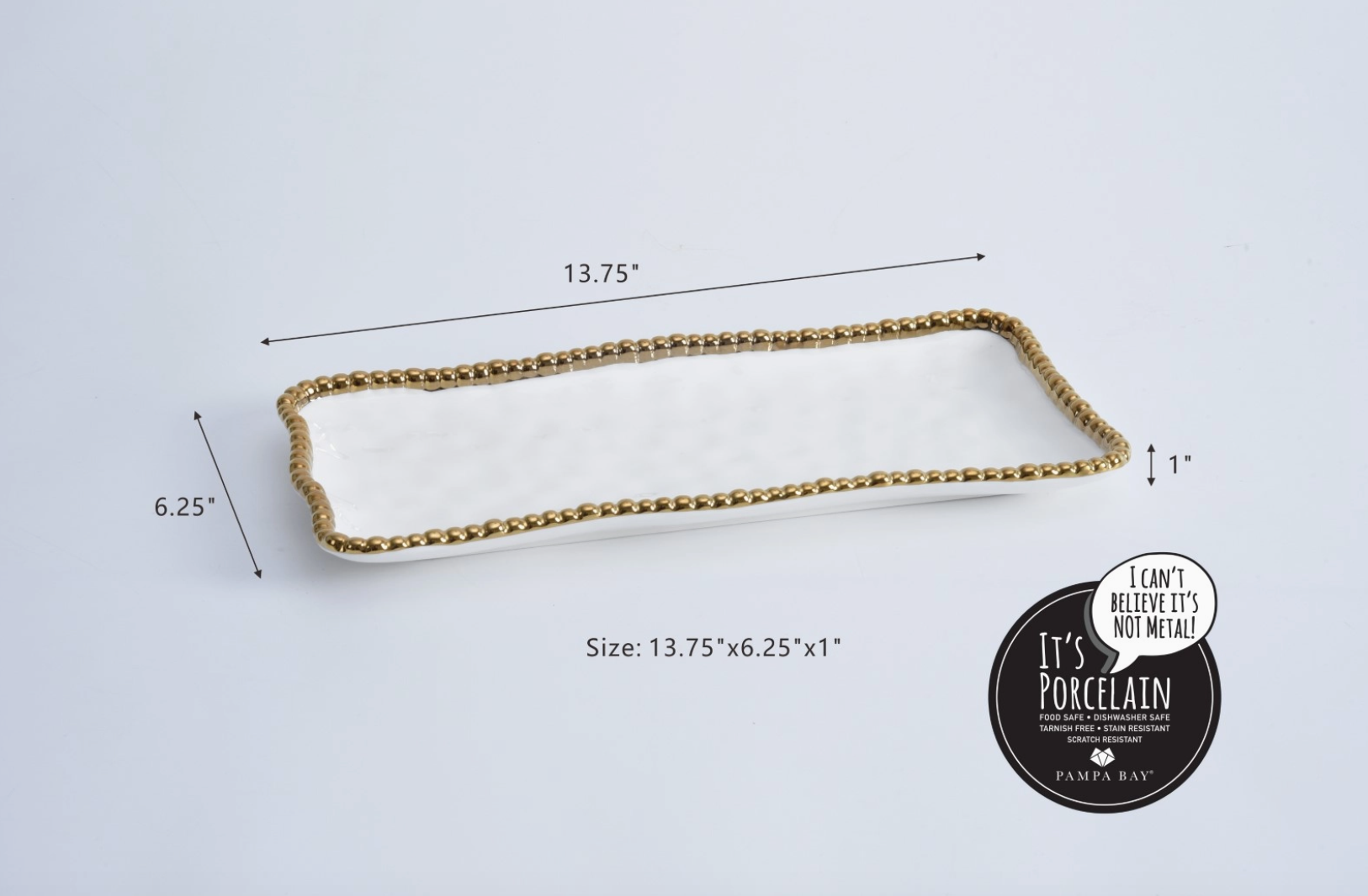 Porcelain Pampa Bay rectangular serving tray in white with a gold beaded edge measuring 13.75 by 6.25 by 1 inch and highlighted with "It's Porcelain" branding