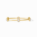 Gold bangle bracelet with four round white stone settings